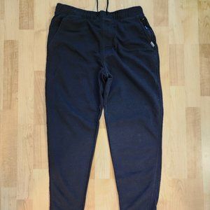 Black joggers with zipped pockets.